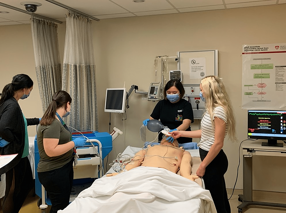 Medical-students-going-through-ACLS-training-using-the-facial-overlays-in-the-LHEARN-Centre-at-Lakeridge-Health-Hospital.