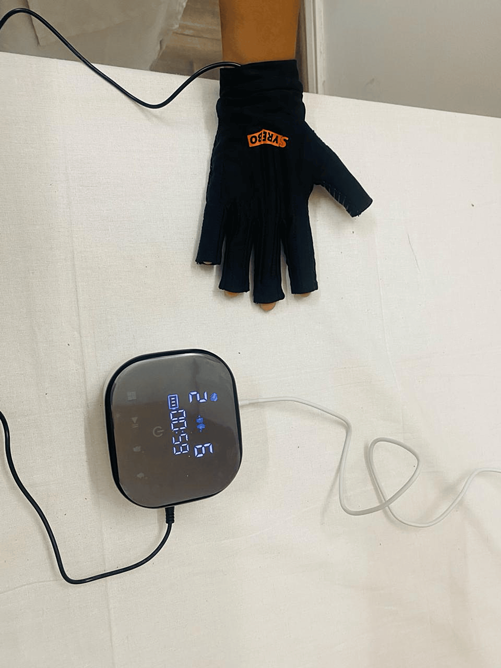 -Patient-using-soft-robotic-gloves-(Syrebo-rehabilitation)-